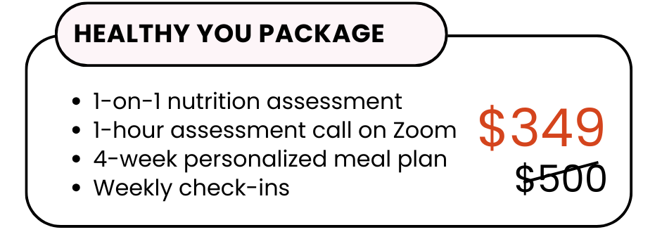 A woman in athletic wear sitting on a yoga mat indoors, smiling.