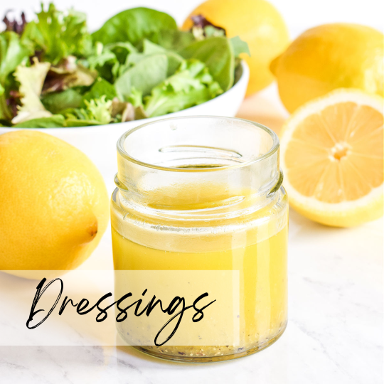 A woman in athletic wear sitting on a yoga mat indoors, smiling.