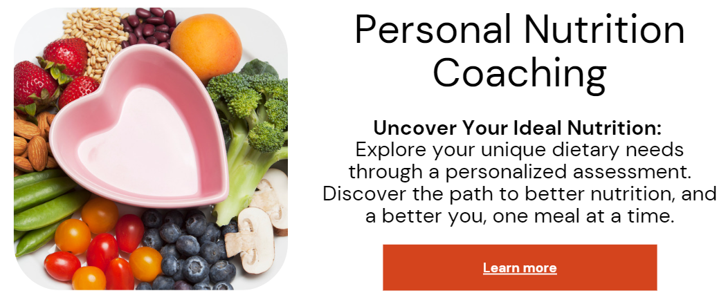 A woman in athletic wear sitting on a yoga mat indoors, smiling.