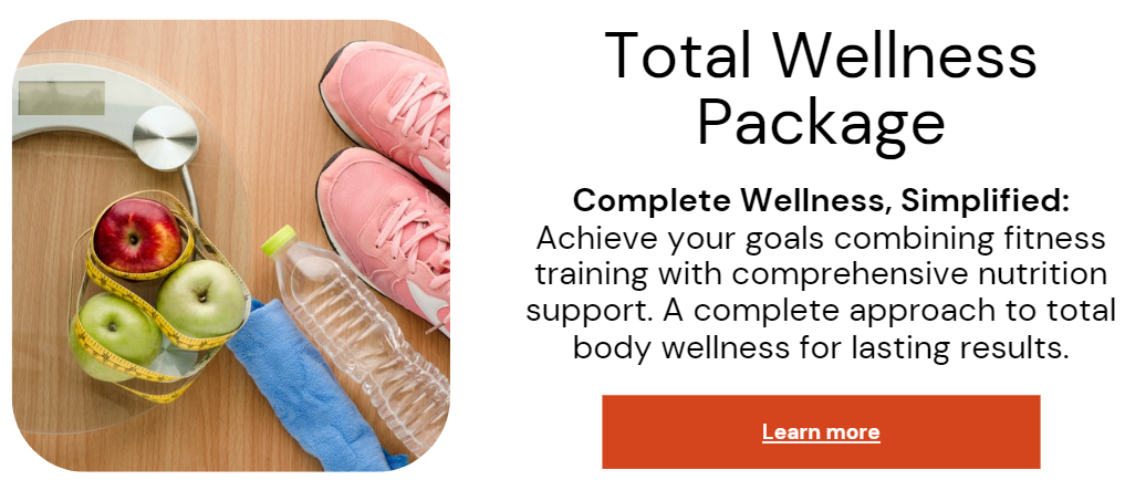 A woman in athletic wear sitting on a yoga mat indoors, smiling.